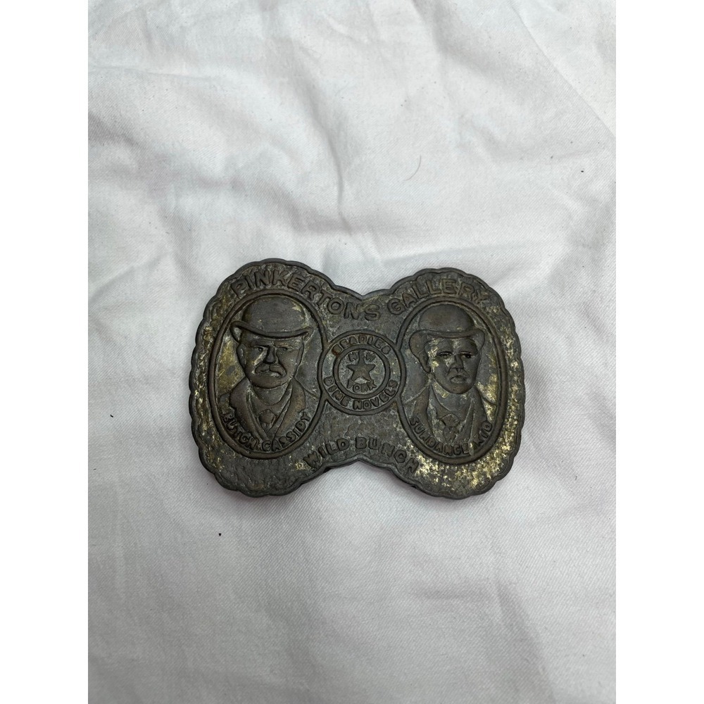 vintage belt buckle featuring "Pinkerton's Gallery" with images of Butch
